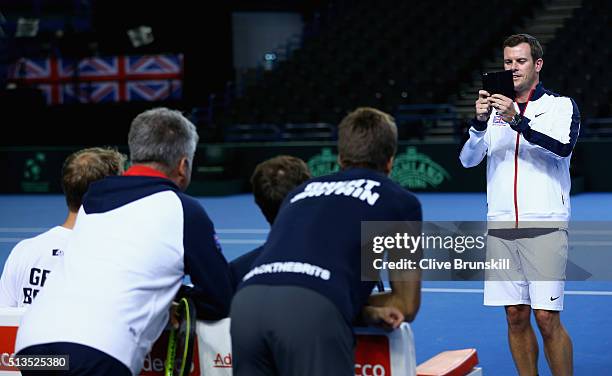 Great Britain team captain Leon Smith takes a photograph of Jamie Murray, Dom Inglot,Aljaz Bedene and Doubles Coach Louis Cayer of Great Britain...