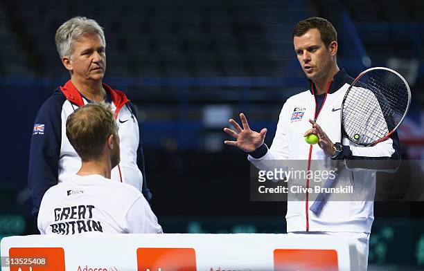 Great Britain team captain Leon Smith discusses tatics with Dom Inglot and Doubles Coach Louis Cayer of Great Britain during a doubles practice...