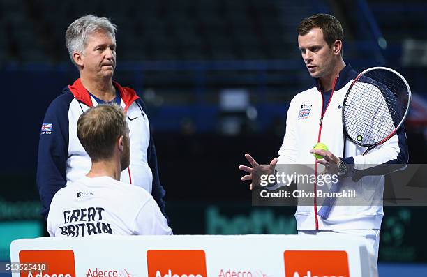 Great Britain team captain Leon Smith discusses tatics with Dom Inglot and Doubles Coach Louis Cayer of Great Britain during a doubles practice...