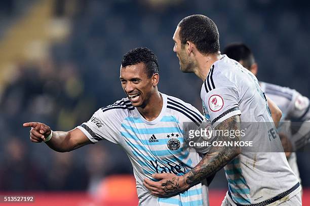 Fenerbahce's Portuguese forward Nani celebrates with his teammates after scoring a goal during the Zirrat Tukish Cup football match between...