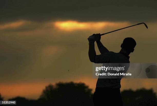 European team player Paul Casey of England hits a shot on the practice ground during the final practice day for the 35th Ryder Cup Matches at the...