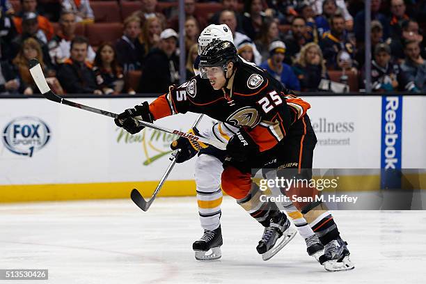 Carlo Colaiacovo of the Buffalo Sabres battles Mike Santorelli of the Anaheim Ducks for postion during the third period of a game at Honda Center on...