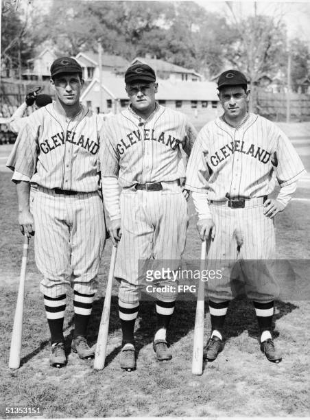 Three members of the Cleveland Indians baseball team pose together, with their bats, before a pre-season game against the New York Giants,...