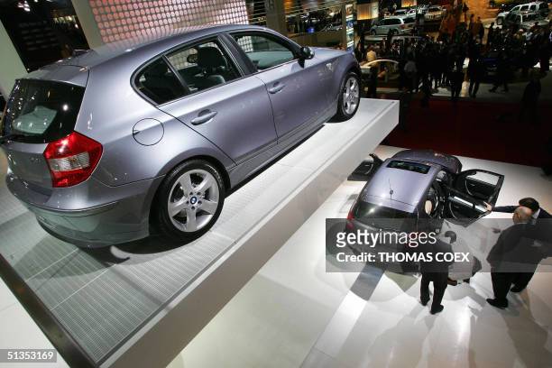 Cars are seen during the press day at the Paris Motor Show on the eve of the opening day, 24 September 2004. AFP PHOTO / THOMAS COEX