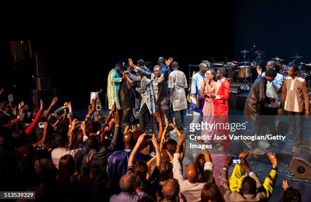 Senegalese singer Youssou N'Dour his band, Super Etoile de Dakar, take a bow after their 2014 Next Wave Festival performance at the BAM Howard Gilman...