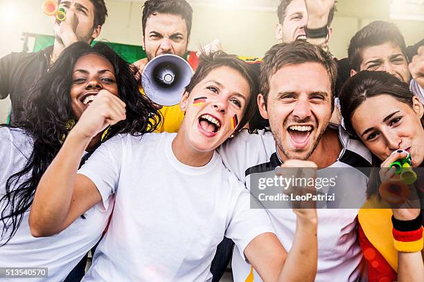 germany supporters in the stadium - soccer germany stockfoto's en -beelden