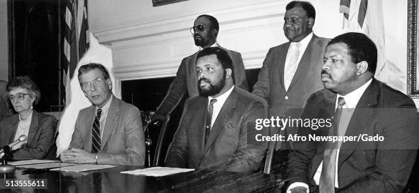 Politician and Maryland congressional representative Elijah Cummings and politicians during a political hearing, 1988.