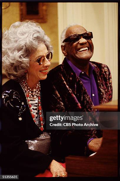 Yetta, portrayed by American actress Ann Morgan Guilbert, sits at the piano with Sammy Portnoy, portrayed by American singer Ray Charles , in a scene...