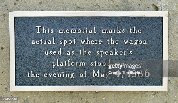 An informational plaque is seen at the Haymarket Memorial September 24, 2004 in Chicago, Illinois. The memorial marks the spot of Haymarket riot of...