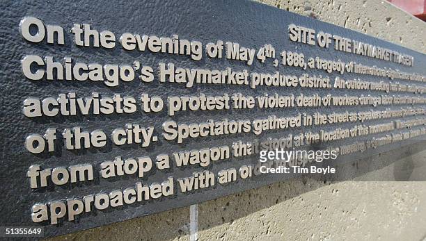 An informational plaque is seen at the Haymarket Memorial is seen September 24, 2004 in Chicago, Illinois. The memorial marks the spot of Haymarket...