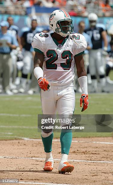 Patrick Surtain of the Miami Dolphins walks on the field during the game against the Tennessee Titans at Pro Player Stadium on September 11, 2004 in...