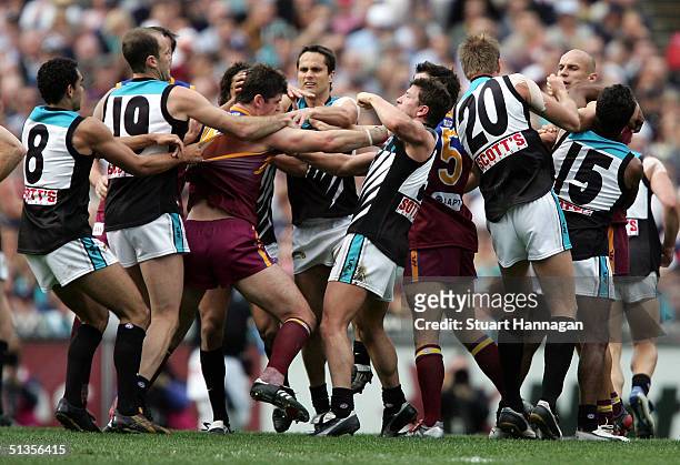 Fight breaks out in the center square during the AFL Grand Final between the Brisbane Lions and Port Adelaide Power at the Melbourne Cricket Ground...