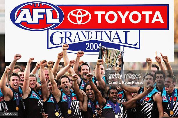 The Port Adelaide Power hold aloft the 2004 Premiership Cup after the AFL Grand Final between the Port Adelaide Power and the Brisbane Lions at the...