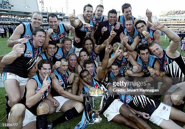 Port Power celebrate with the cup after the AFL Grand Final between the Brisbane Lions and Port Adelaide Power at the Melbourne Cricket Ground...