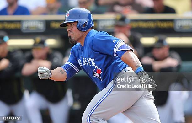 Catcher Humberto Quintero of the Toronto Blue Jays singles to left field in the second inning of the Spring Training Game against the Pittsburgh...