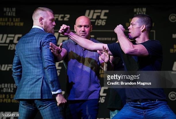 Featherweight champion Conor McGregor and Nate Diaz face off during the UFC 196 Press Conference at David Copperfield Theater in the MGM Grand...