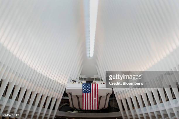 Image was created using a variable planed lens.) An American flag is displayed inside the World Trade Center transit hub in New York, U.S., on...