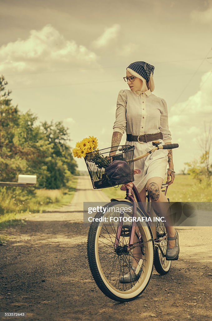 Young woman with the bicycle