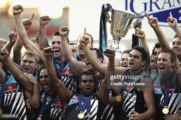 Port Adelaide celebrate with the cup after the AFL Grand Final between the Port Adelaide Power and the Brisbane Lions at the Melbourne Cricket Ground...