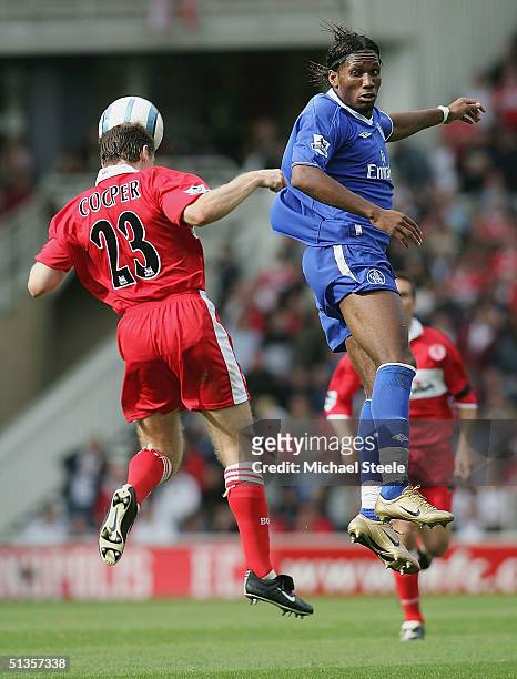 Didier Drogba of Chelsea jumps with Colin Cooper of Middlesbrough during the FA Barclaycard Premiership match between Middlesbrough and Chelsea at...