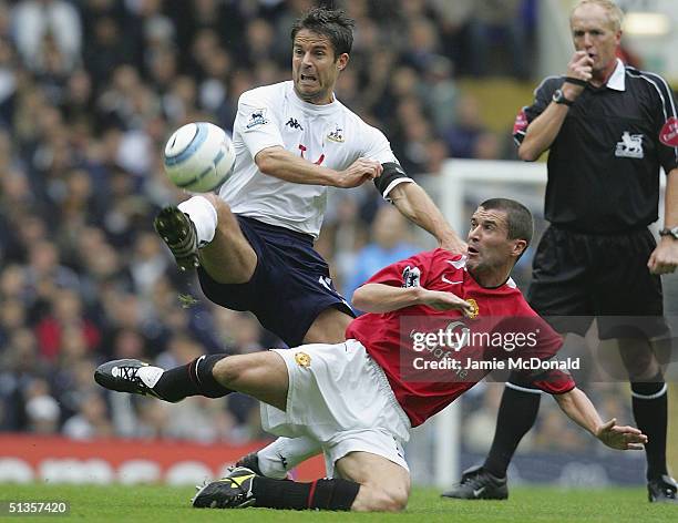 Roy Keane of Manchester United challenges Jamie Redknapp of Spurs during the Barclays Premiership match between Tottenham Hotspur and Manchester...