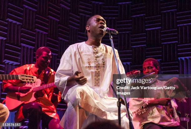 Senegalese singer Youssou N'Dour and members of his band, Super Etoile de Dakar, perform in an 'unplugged,' acoustic set at Joe's Pub, New York, New...
