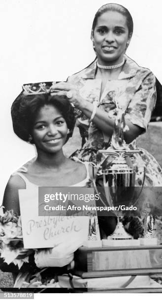 Marguerite Belafonte crowning a beauty pageant winner, 1965.