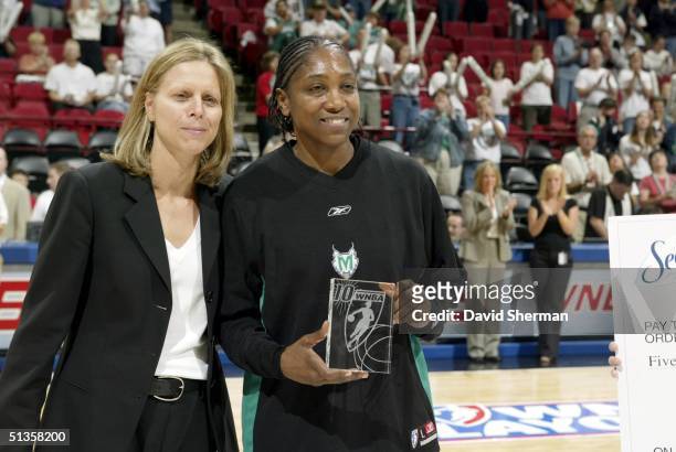 Teresa Edwards of the Minnesota Lynx is presented the the 2004 WNBA Kim Perrot Sportsmanship Award by WNBA President Val Ackerman prior to game 1 of...