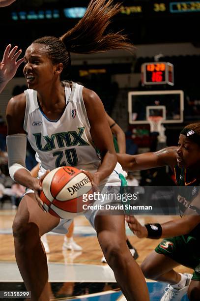 Tamika Williams of the Minnesota Lynx of the Seattle Storm drives during game 1 of the 2004 Western Conference semi-finals on September 25, 2004 at...