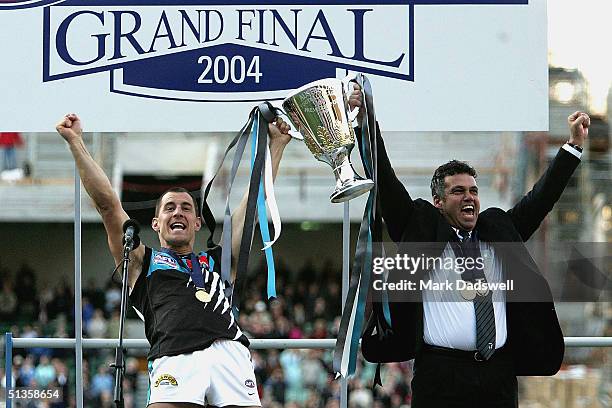 Warren Tredrea captain and Mark Williams coach of the Power celebrate with the Premiership Cup after winning the AFL Grand Final between the Port...