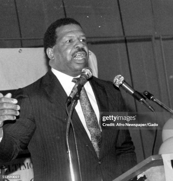 Politician and Maryland congressional representative Elijah Cummings speaking at a podium, 1985.