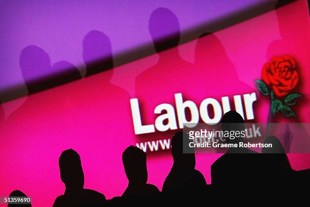 People are seen infront of a party logo during the Labour Party Annual Conference, on September 26, 2004 in Brighton, England.