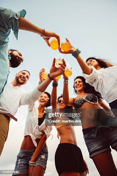 group of friends cheers with beer outside - drunk girls stock pictures, royalty-free photos & images