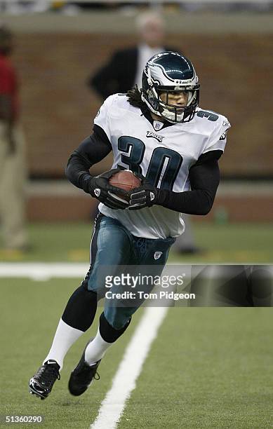 Reed of the Philadelphia Eagles runs a reverse on a kick return against the Detroit Lions in the third quarter at Ford Field on September 26, 2004 in...
