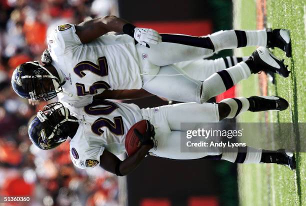 Chris McAlister of the Baltimore Ravens is congratulated by teammate Ray Lewis of the Ravens after recovering a fumble against the Cincinnati Bengals...