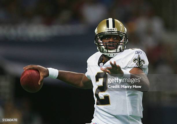 Quarterback Aaron Brooks of the New Orleans Saints looks to pass against the St. Louis Rams during the third quarter at the Edward Jones Dome on...