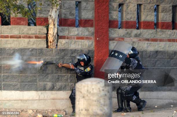 Riot police shoot tear gas at students protesting in Tegucigalpa against the murder of indigenous activist Berta Caceres, in La Esperanza, 200 km...