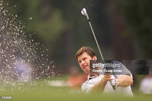 Nick Faldo of England hits a bunker shot during the first round of the PGA Championship at the Atlanta Athletic Club in Duluth, GA. DIGITAL IMAGE....