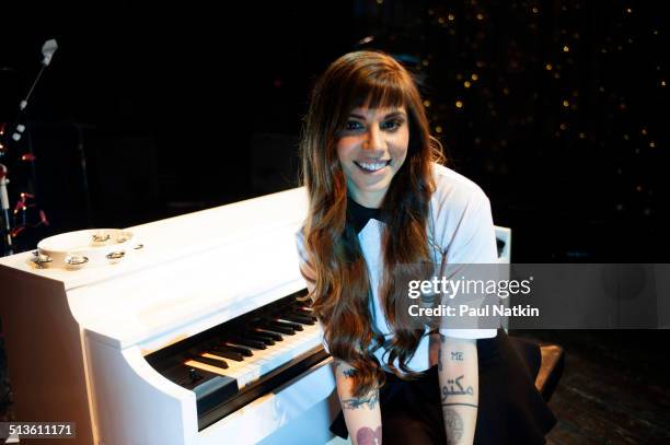 Portrait of American musician Christina Perri as she poses with a piano at the House of Blues, Chicago, Illinois, April 9, 2014.