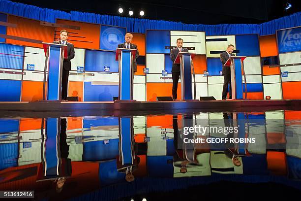 Republican Presidential candidates Marco Rubio, Donald Trump, Ted Cruz and John Kasich pose for a photo at start of the Republican Presidential...