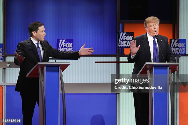 Republican presidential candidates Sen. Marco Rubio and Donald Trump participate in a debate sponsored by Fox News at the Fox Theatre on March 3,...