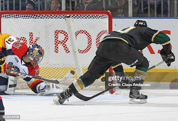 Christian Dvorak of the London Knights scores a goal from a beautiful drop pass from teammate Mitchell Marner against Devin Williams of the Erie...