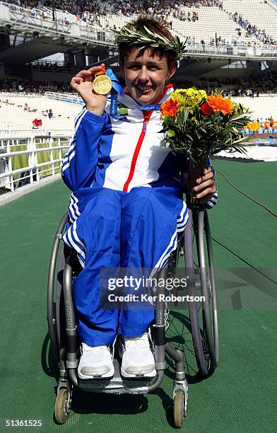 Tanni Grey-Thompson of Great Britain celebrates winning the gold medal in the Womens 400m - T53 Final during the Athens 2004 Paralympic Games at the...