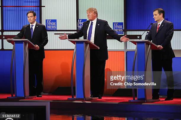 Republican presidential candidates Sen. Marco Rubio , Donald Trump and Sen. Ted Cruz participate in a debate sponsored by Fox News at the Fox Theatre...
