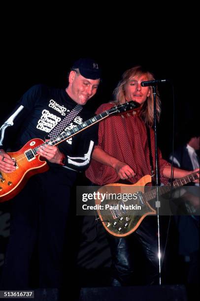 American musicians Rick Nielsen and Robin Zander of Cheap Trick perform onstage, Chicago, Illinois, June 15, 1990.