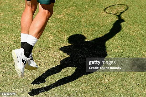 Sam Groth of Australia serves in his match against John Isner of the United States during the Davis Cup tie between Australia and the United States...