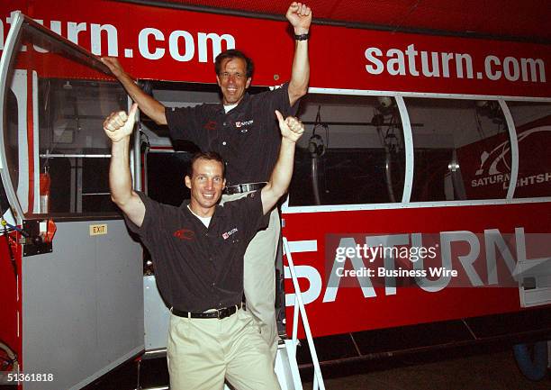 Pilots Carl Harbuck and Douglas McFadden celebrate the Saturn Relay Lightship's record breaking flight.