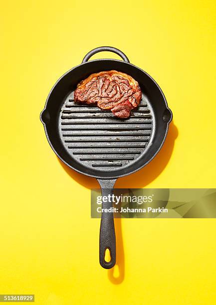 steak in the shape of a brain - cooking pan studio stock pictures, royalty-free photos & images