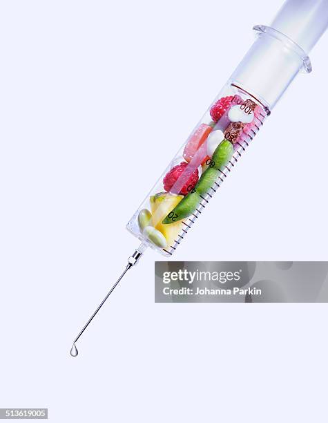 syringe of healthy foods - superfood stock pictures, royalty-free photos & images