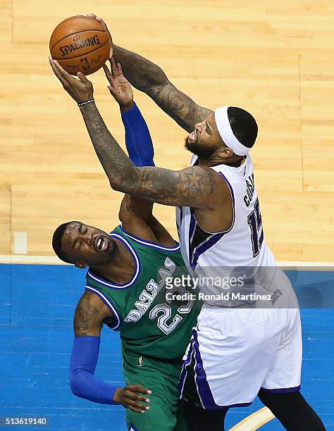 DeMarcus Cousins of the Sacramento Kings takes a shot against Wesley Matthews of the Dallas Mavericks during the second half at American Airlines...